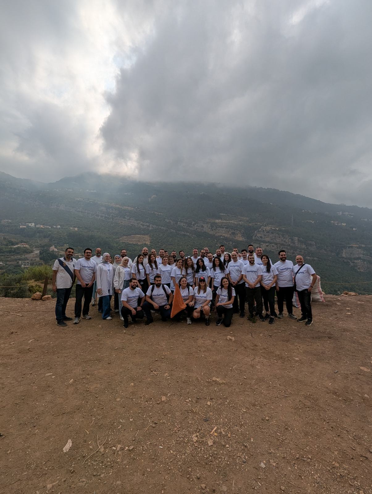 A large corporate group gathered at Sannour Farm